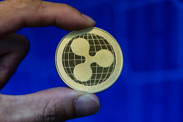 XRP Tests $1 Support As Long Liquidations Surge Inside Multi-Month Wedge