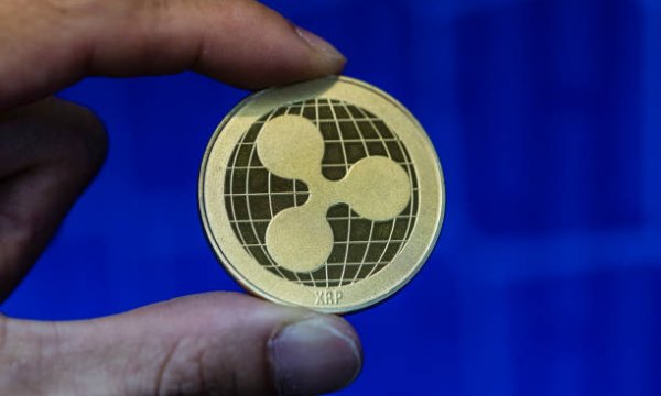 XRP Tests $1 Support As Long Liquidations Surge Inside Multi-Month Wedge